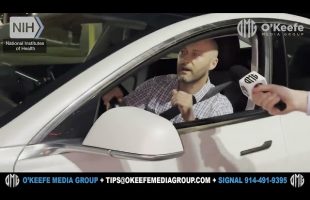 WILD INTERACTION: O’Keefe Chases NIH’s James Welch Speeding Away in Tesla