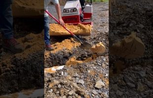Installing Downspout Drain Pipes Under the Parking Lot