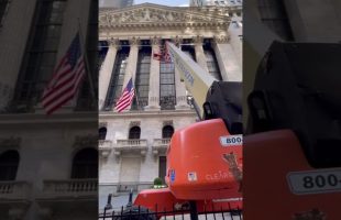 Giant Boom Lift Working on Wall Street